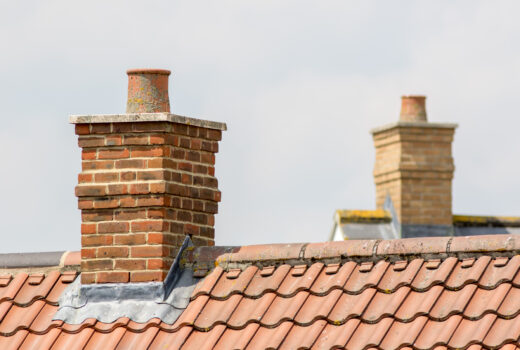Brick,Chimney,Stack,On,Modern,Contemporary,House,Roof,Top.,Urban